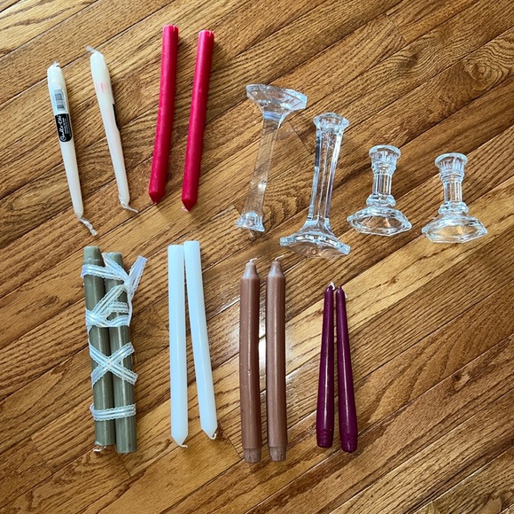 4 glass candlestick holders. 12 long candle sticks all brand new never used.
